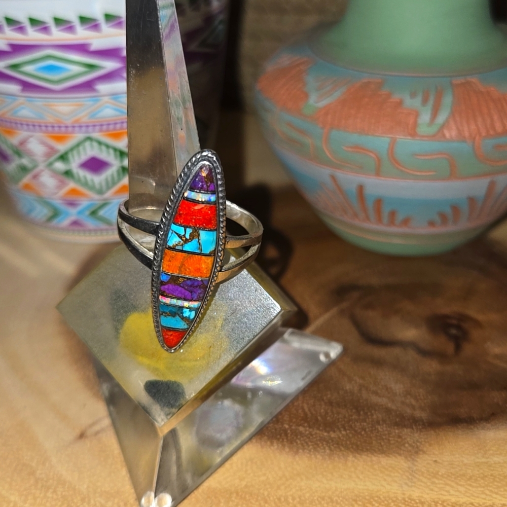 Sterling silver ring with gemstones and shell inlay.